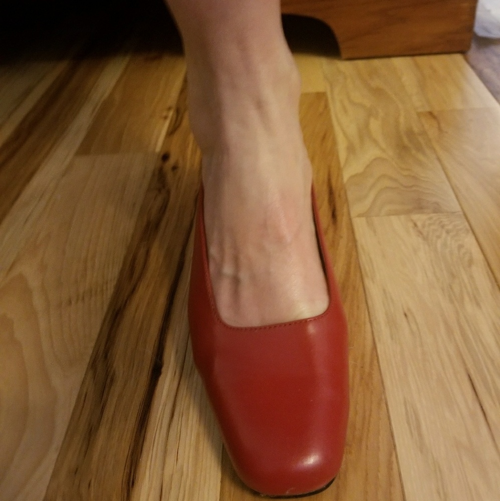 Red low heeled pumps